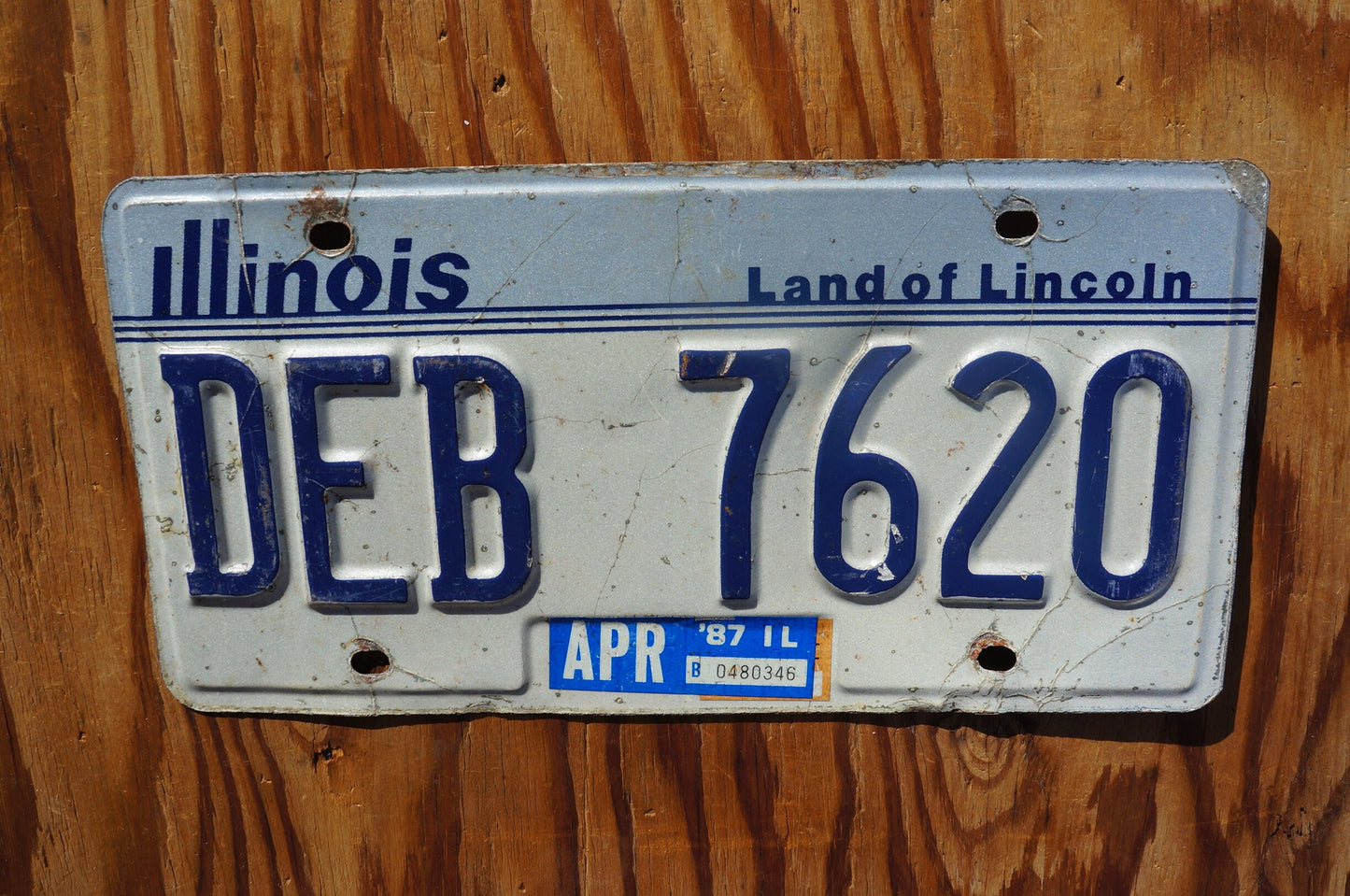 1987 Illinois White License Plate - Land of Lincoln # DEB 7620