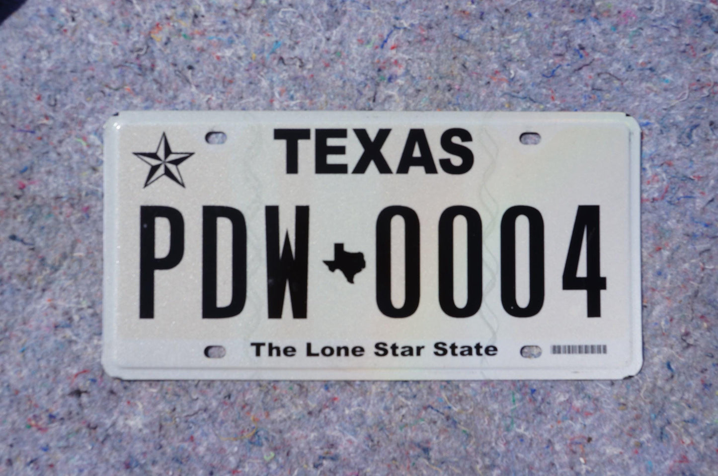 White Texas License Plate # PDW - 0004