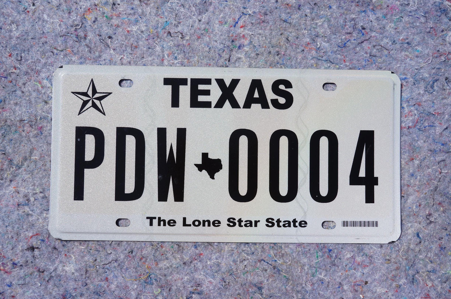 White Texas License Plate # PDW - 0004