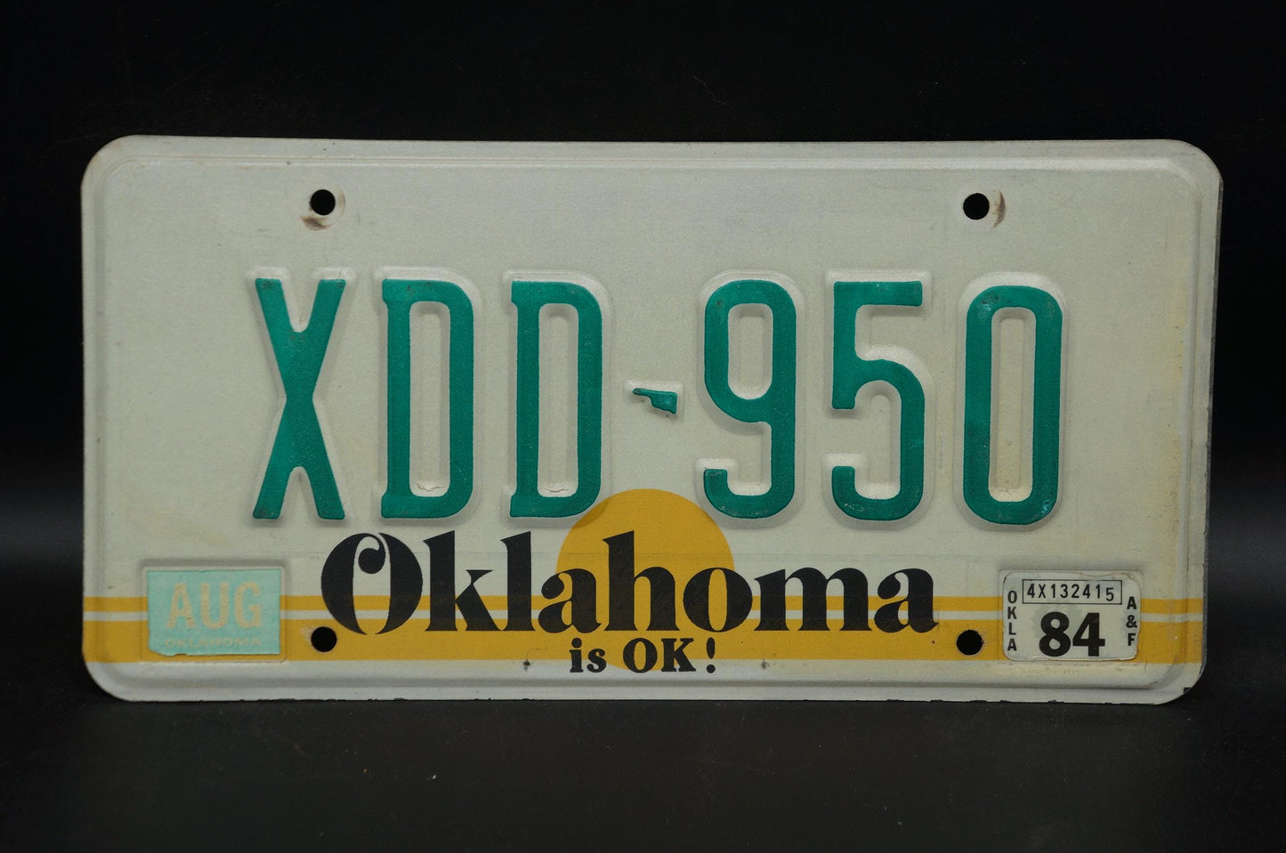 1984 Oklahoma IS OK! Yellow Sun Vintage License Plate # XDD - 950