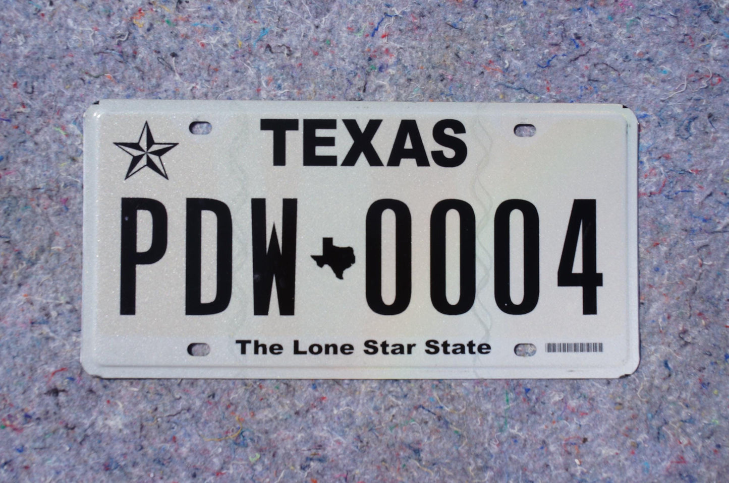 White Texas License Plate # PDW - 0004