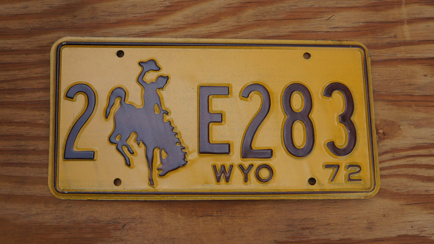 1972 Wyoming License Plate: Yellow Rodeo Cowboy Horse