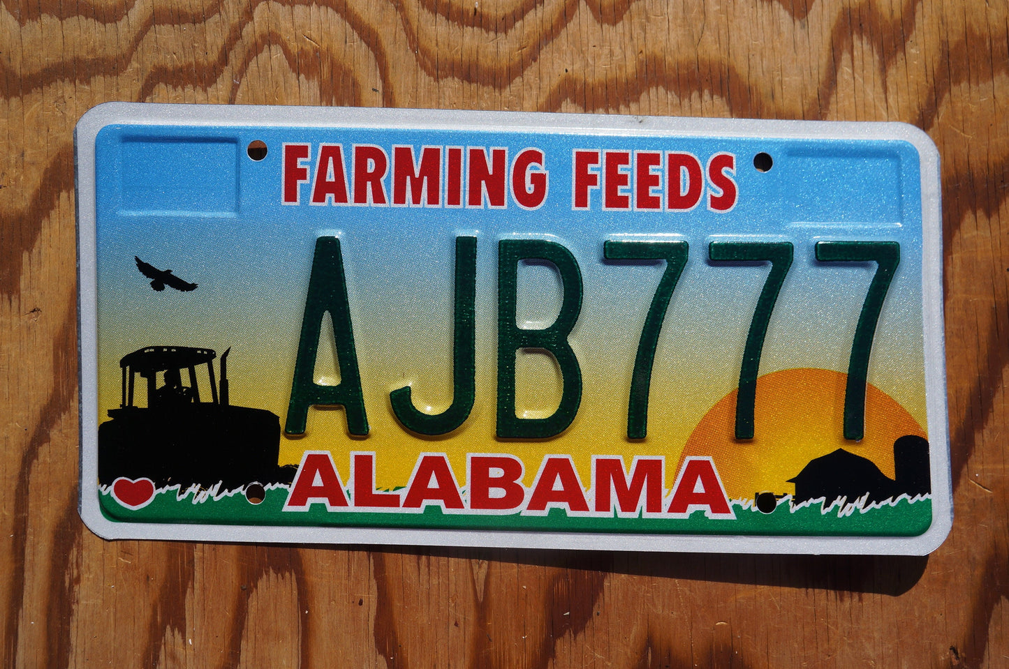 Alabama FARMING FEEDS Colorful Graphic License Plate # AJB 777