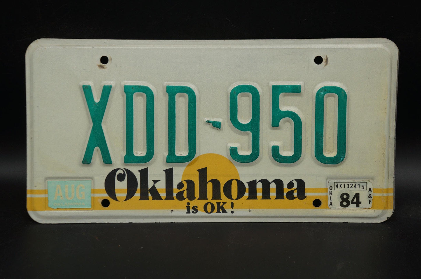 1984 Oklahoma IS OK! Yellow Sun Vintage License Plate # XDD - 950
