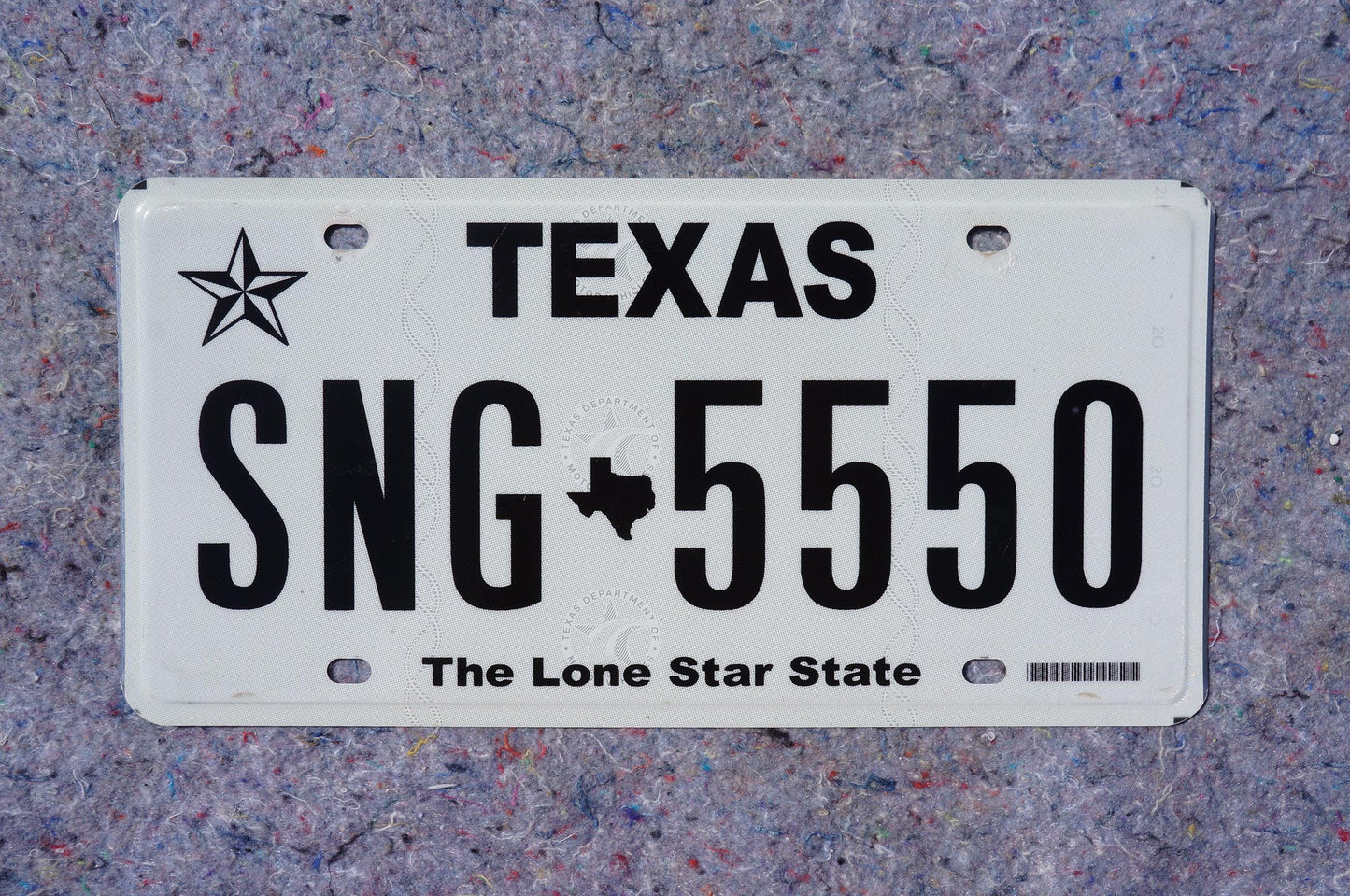 White Texas License Plate # SNG - 5550 The Lone Star State