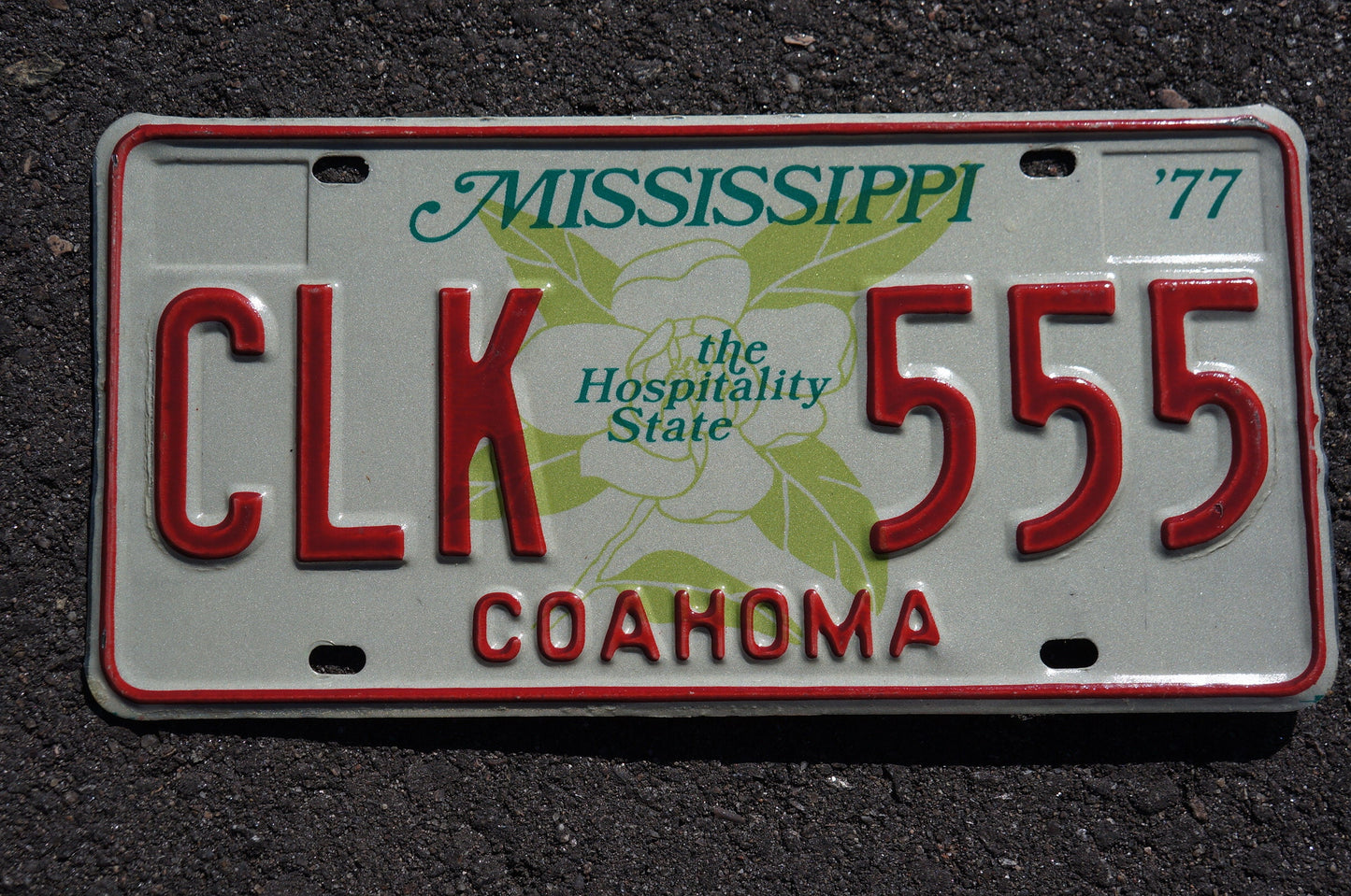 1977 Mississippi Magnolia Flower Graphic The Hospitality State License Plate COAHOMA County # CLK 555