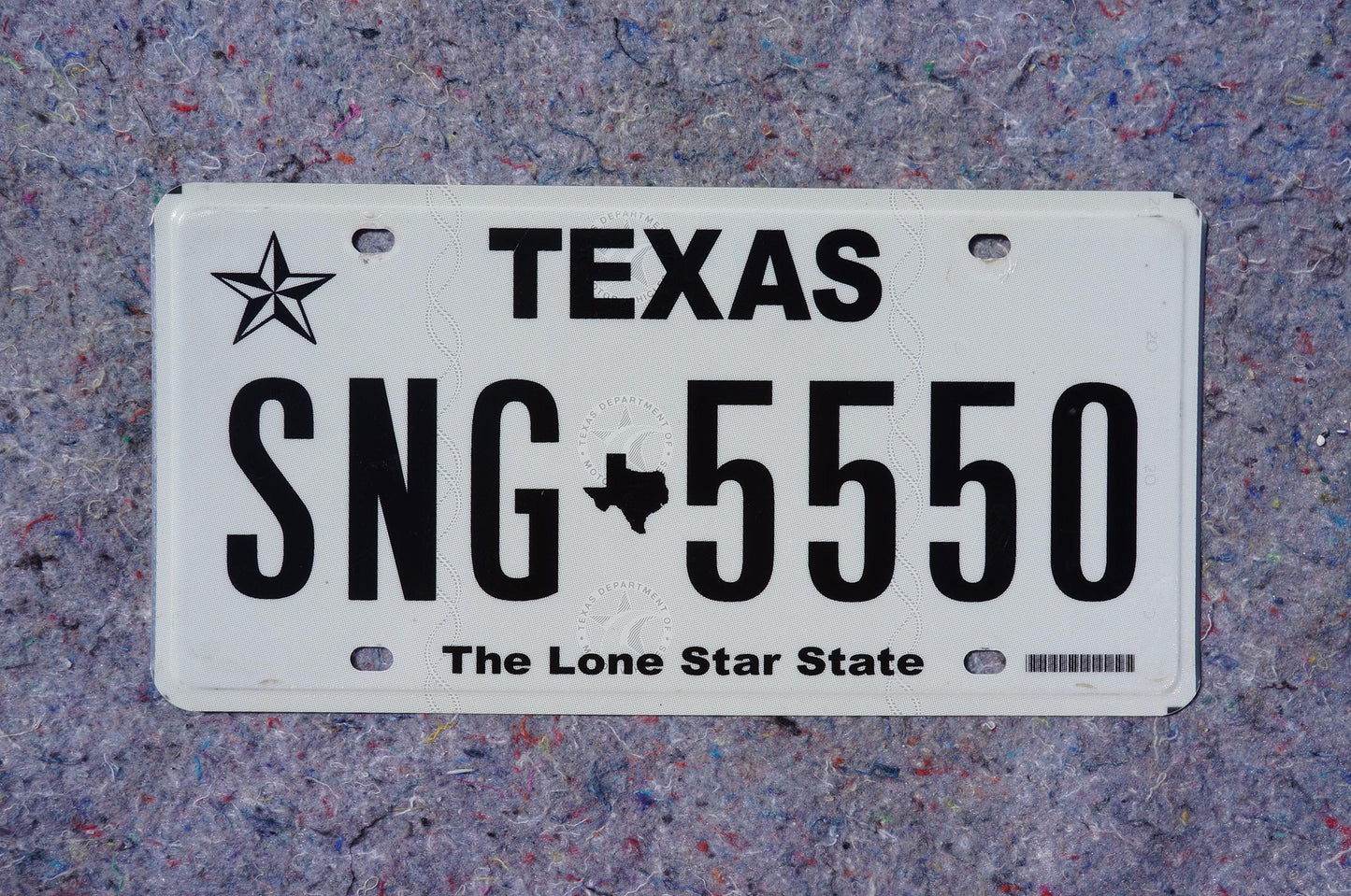 White Texas License Plate # SNG - 5550 The Lone Star State