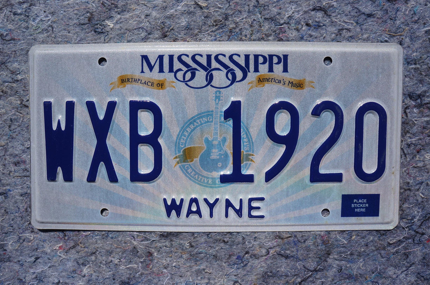 Mississippi Embossed Guitar License Plate # WXB 1920
