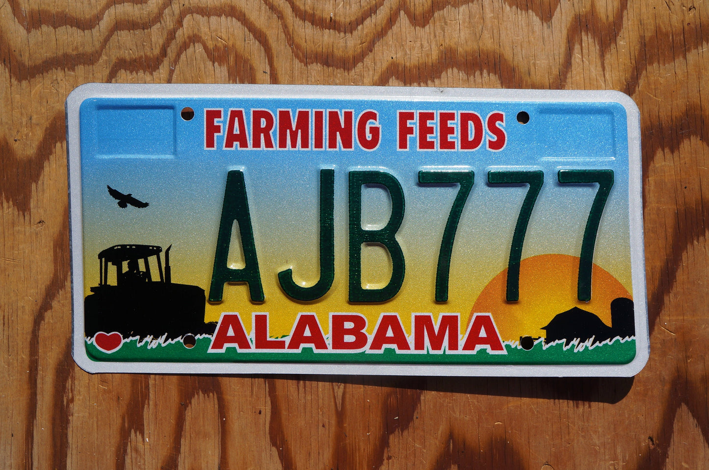 Alabama FARMING FEEDS Colorful Graphic License Plate # AJB 777