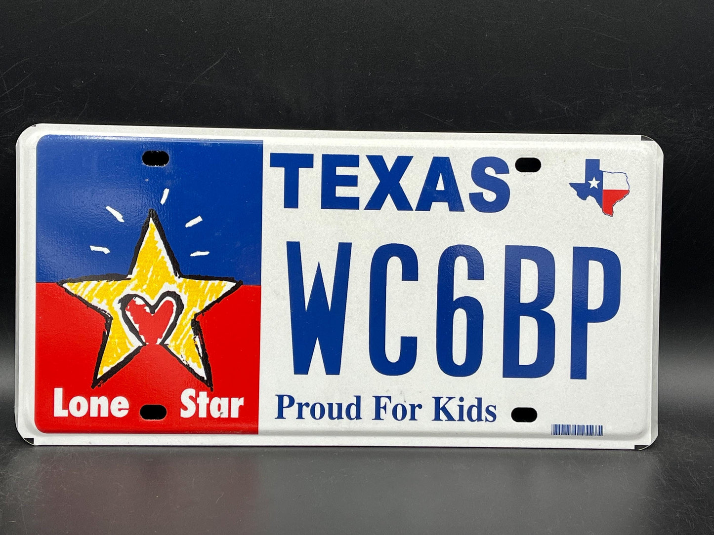 One or More - TEXAS Proud of Kids Graphic License Plate