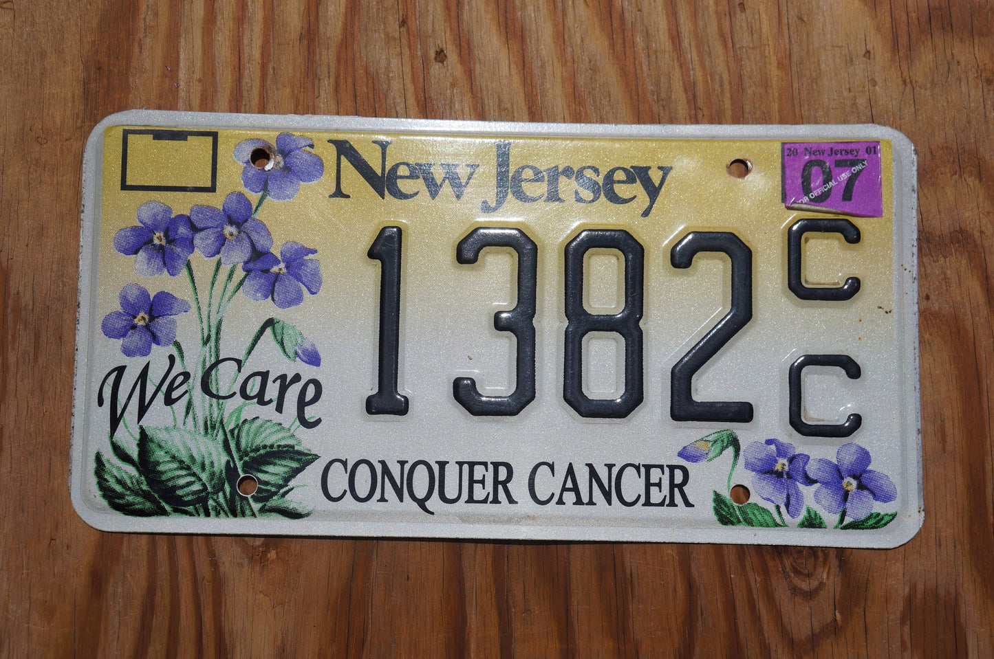 2007 New Jersey CONQUER CANCER Graphic Purple Flowers License Plate - We Care