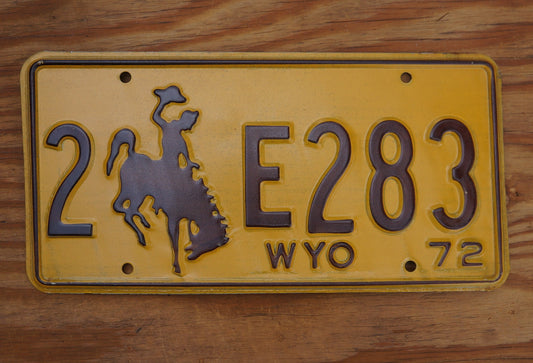 1972 Wyoming License Plate: Yellow Rodeo Cowboy Horse