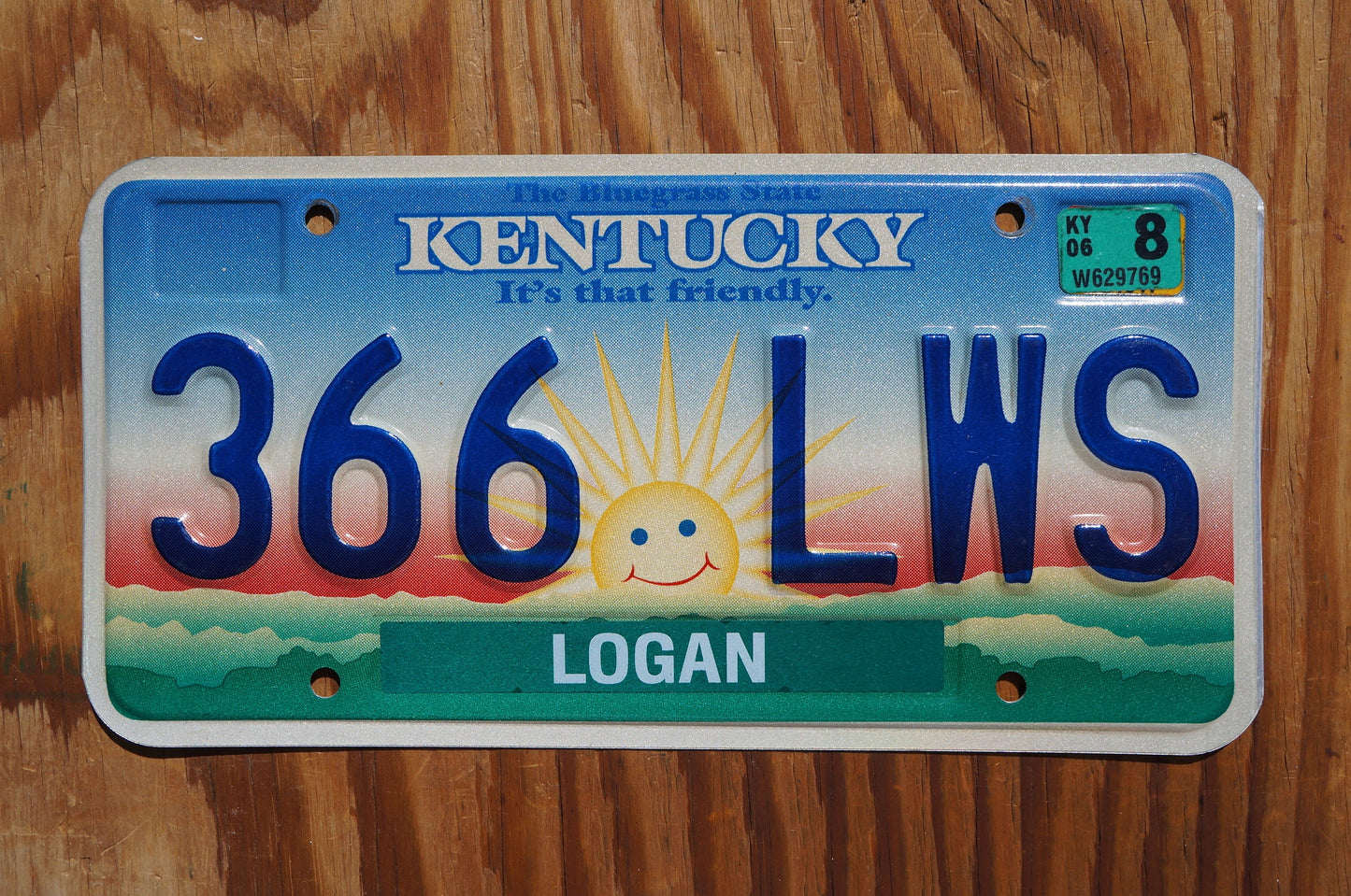 2006 Kentucky smiling sun cloud License Plate - It's that friendly
