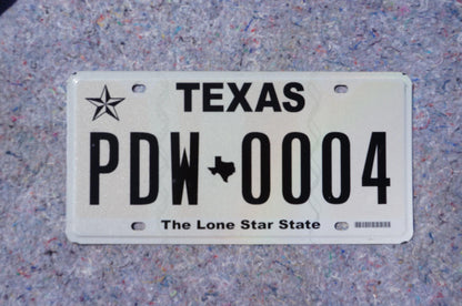 White Texas License Plate # PDW - 0004