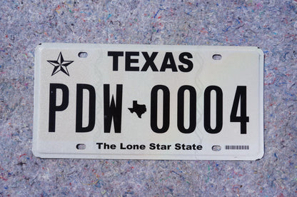 White Texas License Plate # PDW - 0004