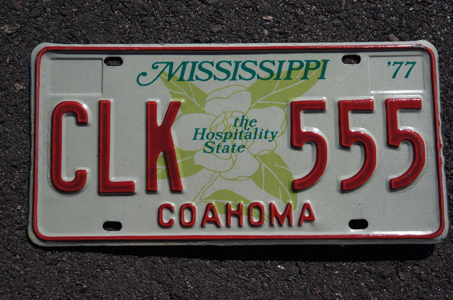 1977 Mississippi Magnolia Flower Graphic The Hospitality State License Plate COAHOMA County # CLK 555