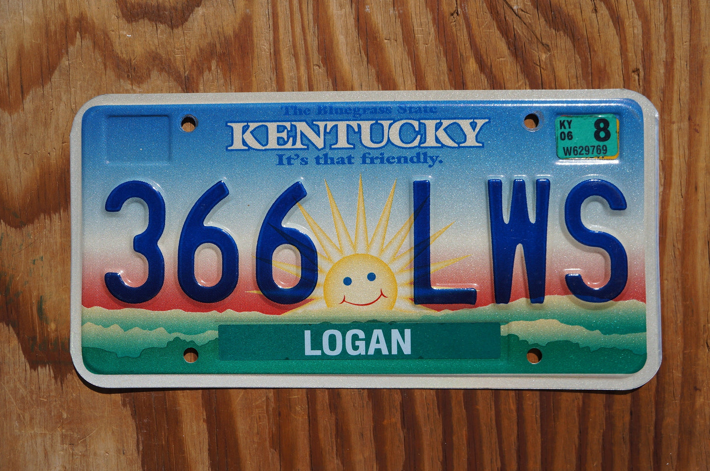 2006 Kentucky smiling sun cloud License Plate - It's that friendly