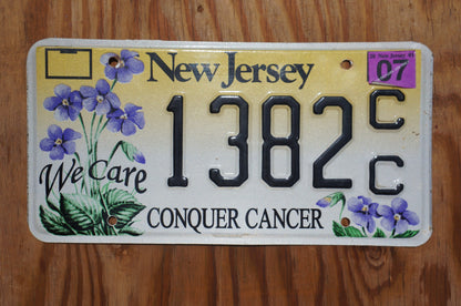 2007 New Jersey CONQUER CANCER Graphic Purple Flowers License Plate - We Care