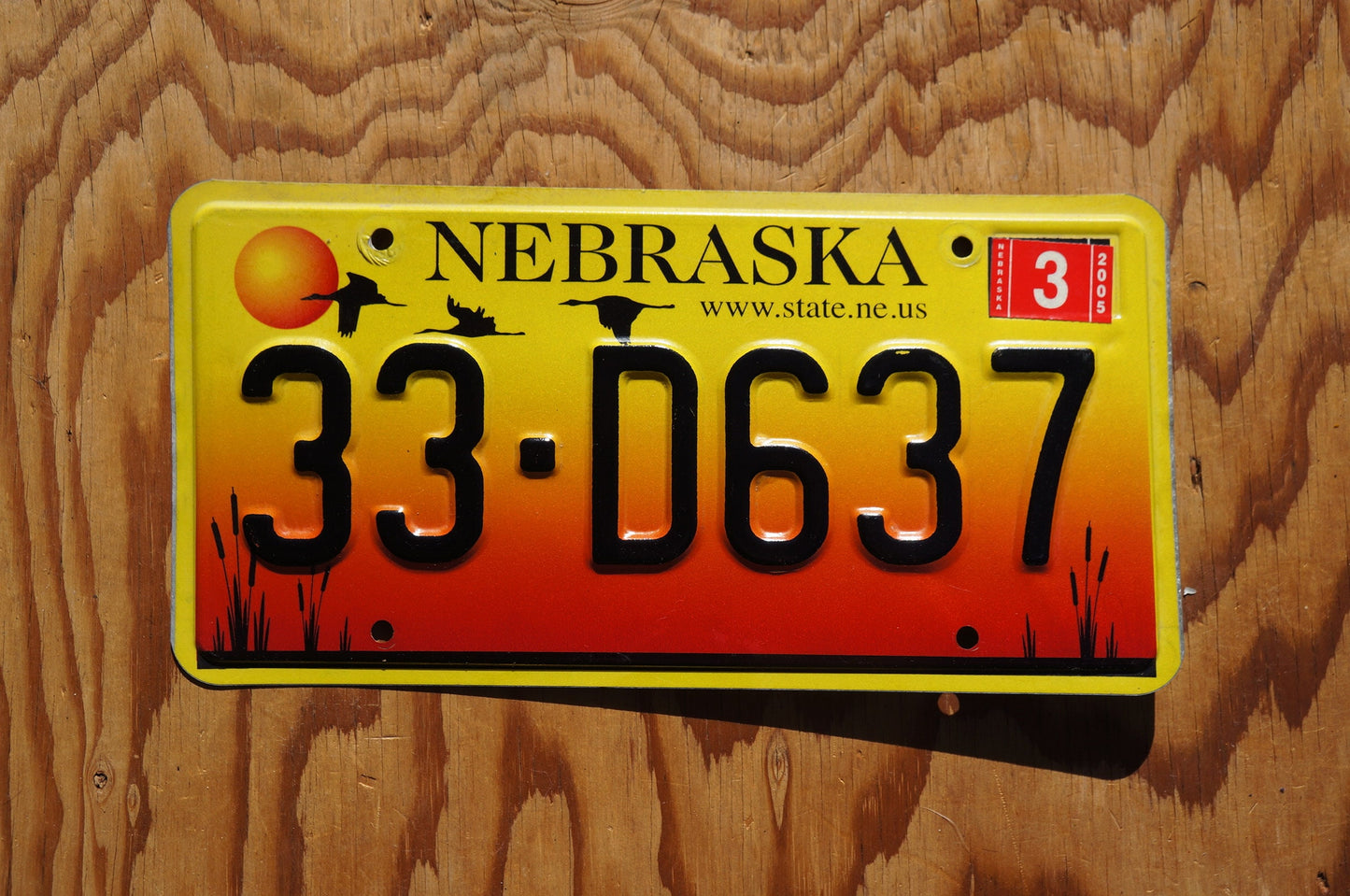 2005 Nebraska GEESE & SUNSET Red Yellow License Plate # 33 - D637