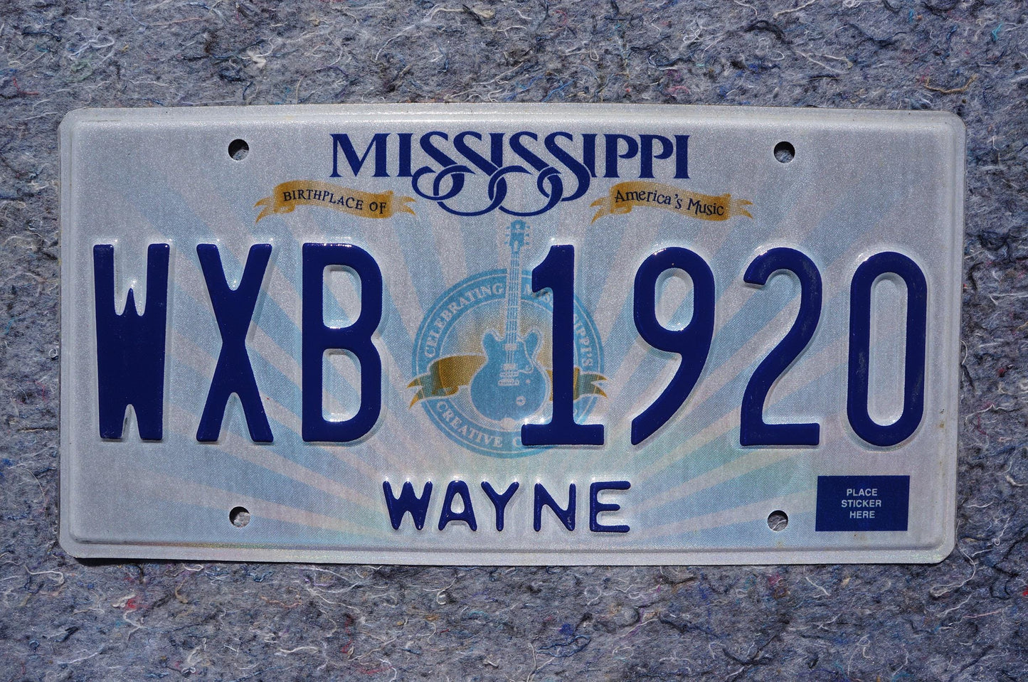 Mississippi Embossed Guitar License Plate # WXB 1920