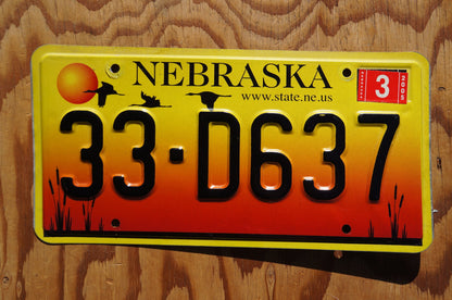 2005 Nebraska GEESE & SUNSET Red Yellow License Plate # 33 - D637
