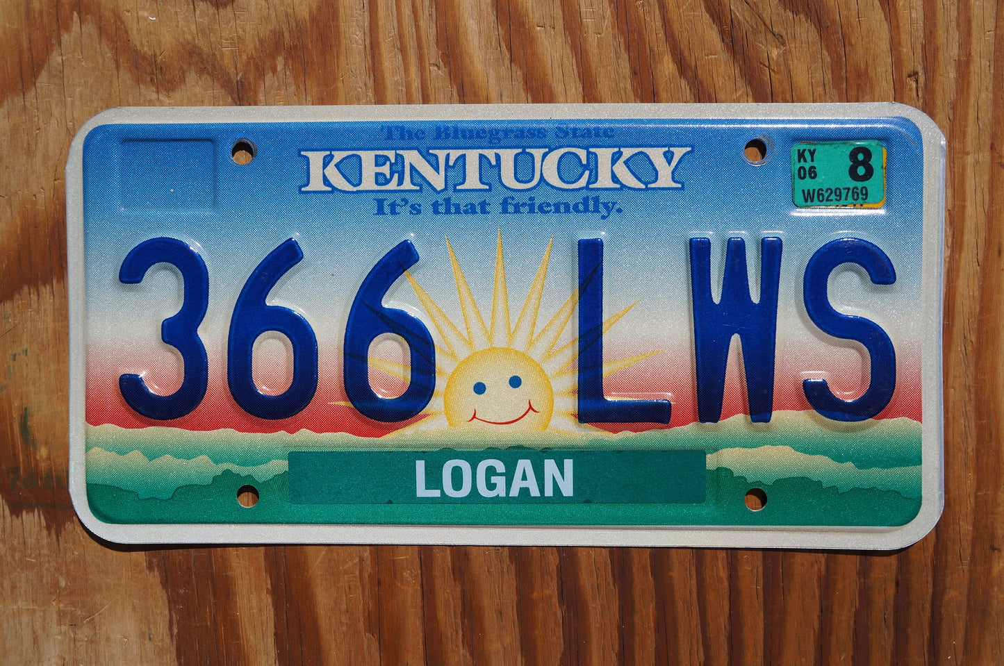 2006 Kentucky smiling sun cloud License Plate - It's that friendly