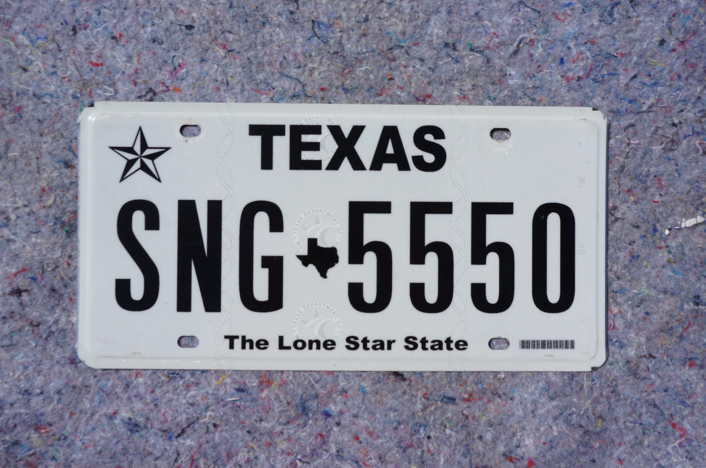 White Texas License Plate # SNG - 5550 The Lone Star State
