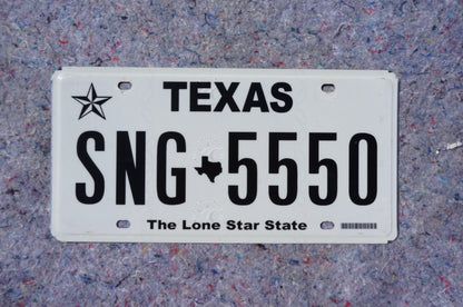 White Texas License Plate # SNG - 5550 The Lone Star State