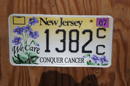 2007 New Jersey CONQUER CANCER Graphic Purple Flowers License Plate - We Care