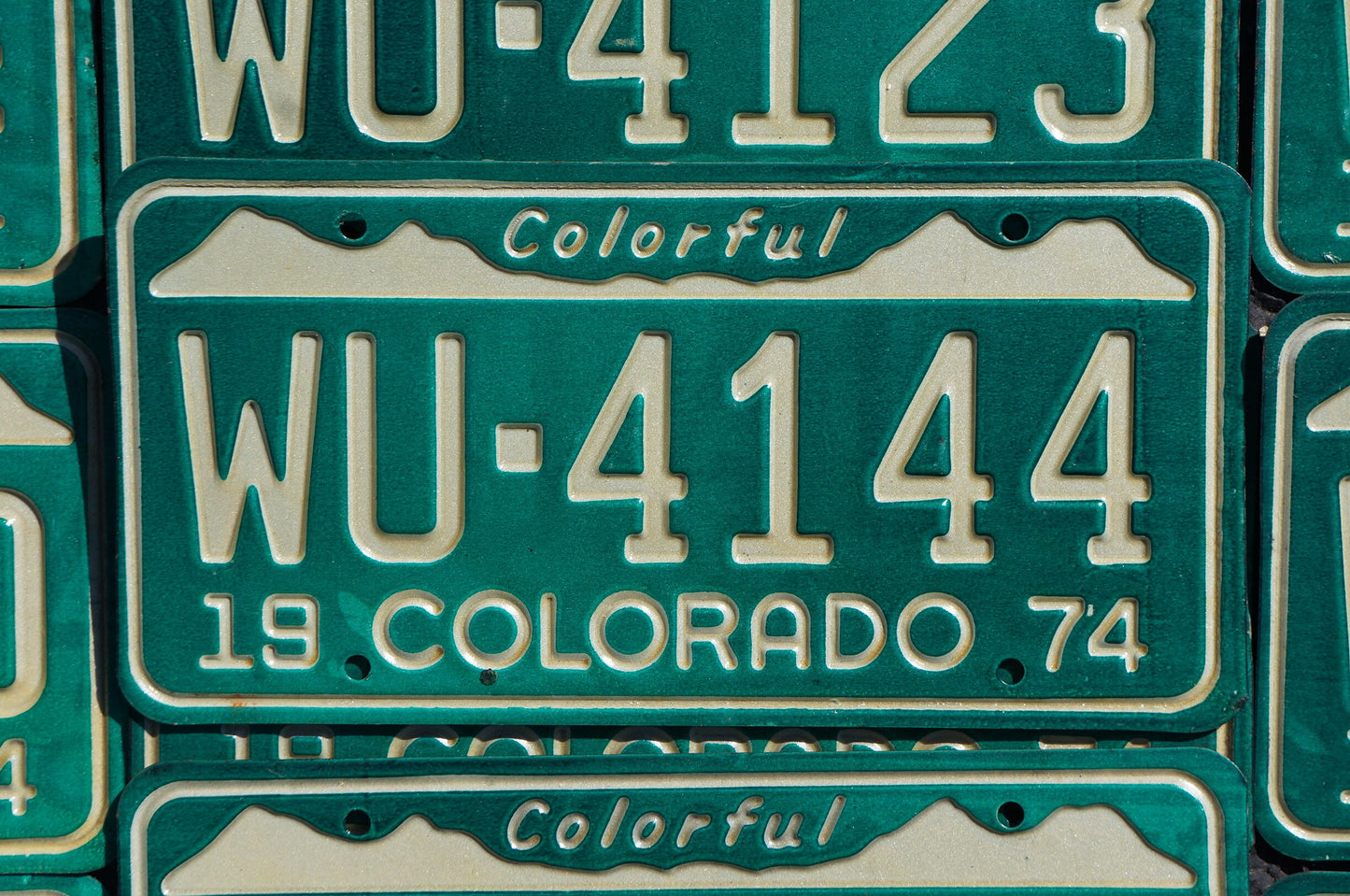 One or More - 1974 Colorful COLORADO SNOW MOUNTAINS Green License Plate