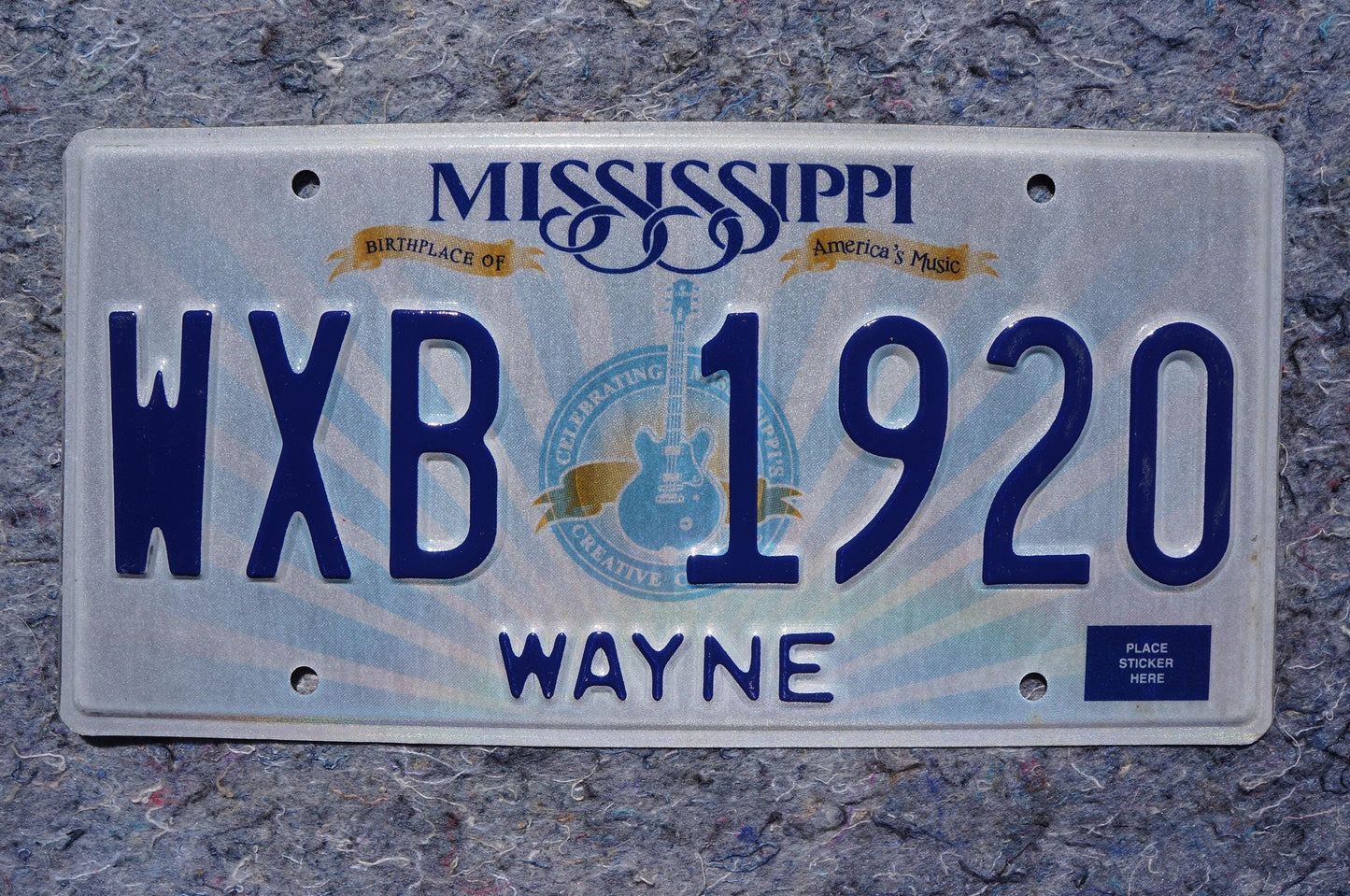 Mississippi Embossed Guitar License Plate # WXB 1920